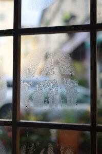 Condensation droplets on the inside of a window pane